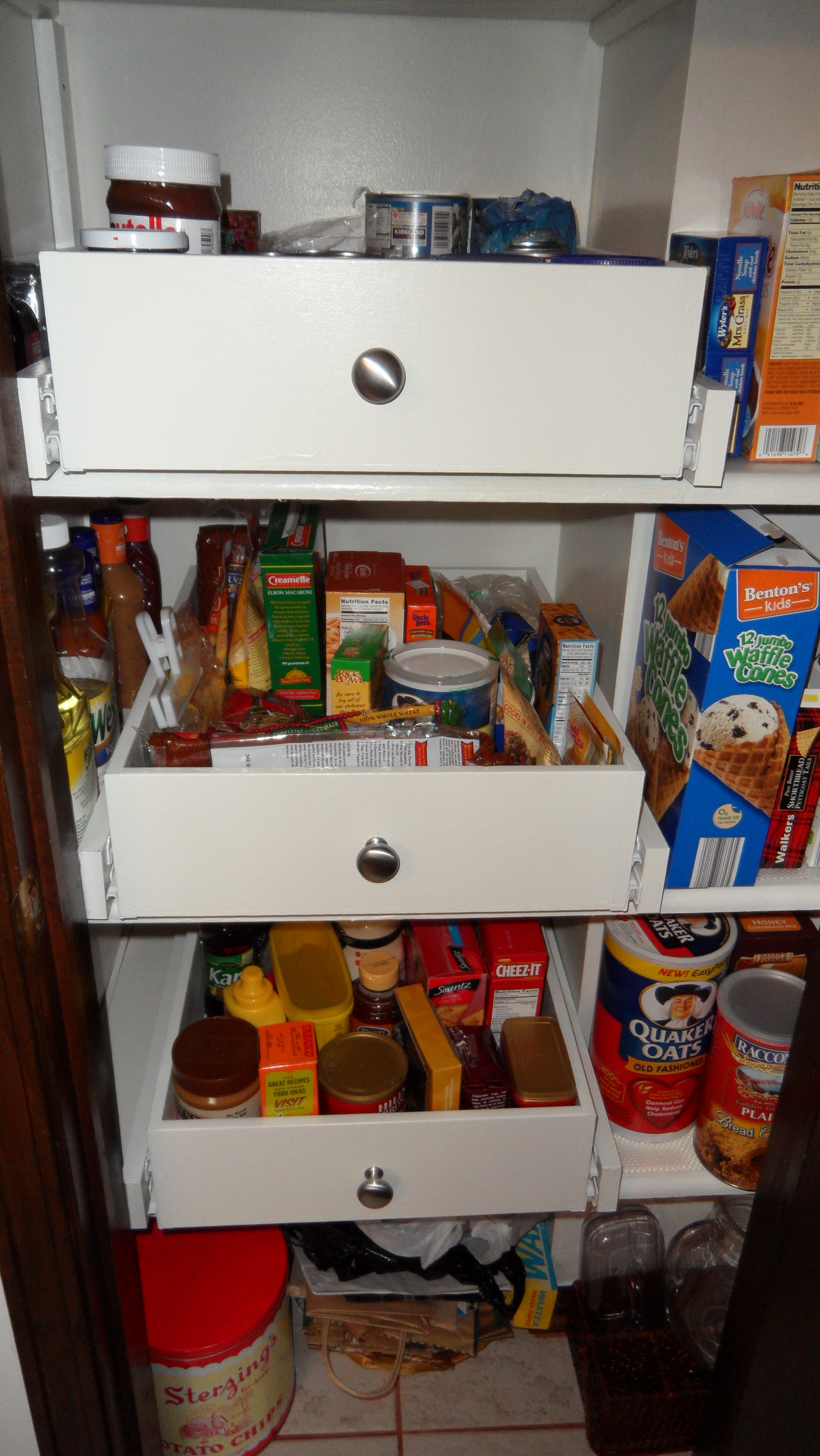 Pull out pantry drawers are an organized, presentable way to store items on  the shelves of your pantry.